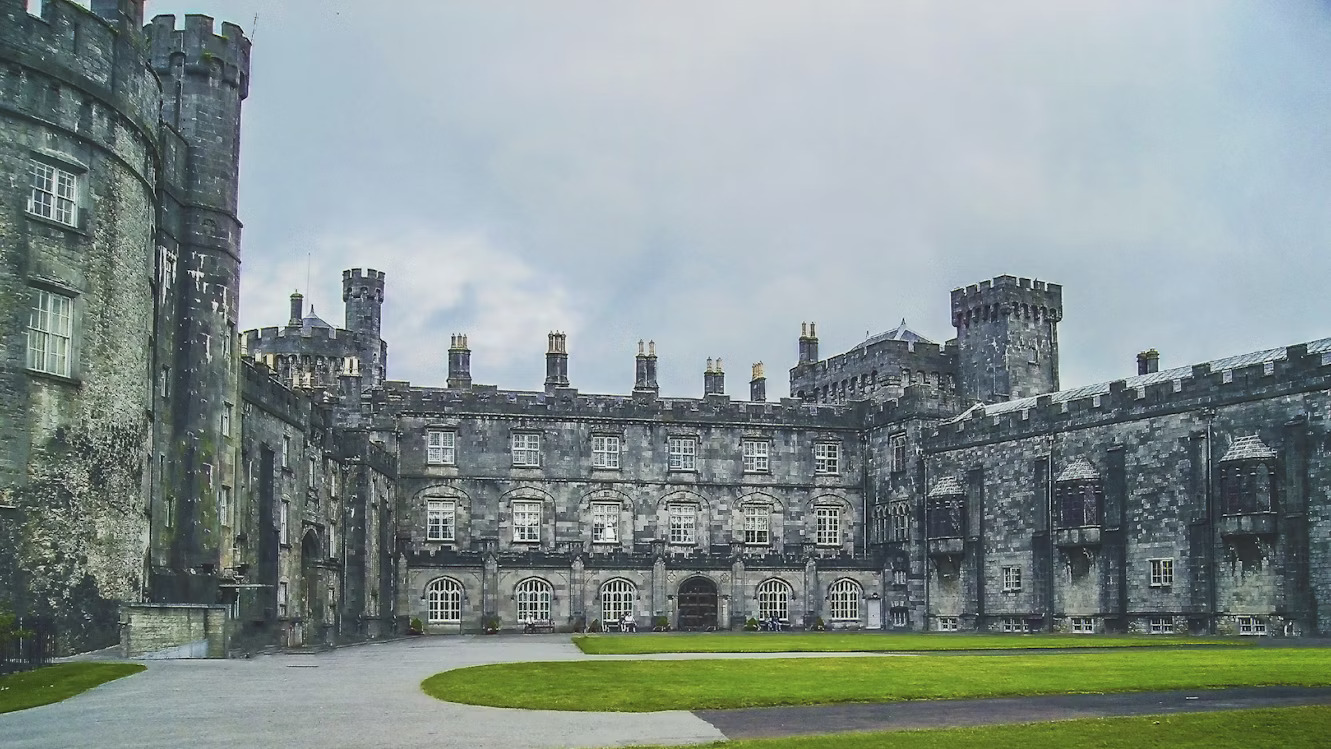 The massive stone towers and manicured lawns of the 12th-century Kilkenny Castle