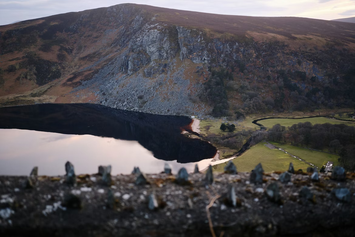 Viewpoint overlooking the dark waters and white sand beach of Lough Tay, County Wicklow