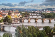 Panoramic view of Prague Old Town and Vltava River, the starting point of a scenic road trip from Prague to Vienna.