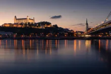 Panoramic view of Bratislava with Bratislava Castle overlooking the Danube River and the historic old town in Slovakia.
