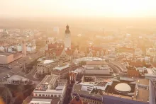 Panoramic view of Leipzig with historic buildings, church towers, and vibrant city streets in Germany.