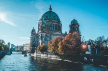 Panoramic view of Berlin, Germany, featuring the city skyline with the Fernsehturm, historic architecture, modern buildings, and iconic urban landmarks under clear daylight, capturing the vibrant atmosphere of the starting point of a Berlin to Dresden road trip.