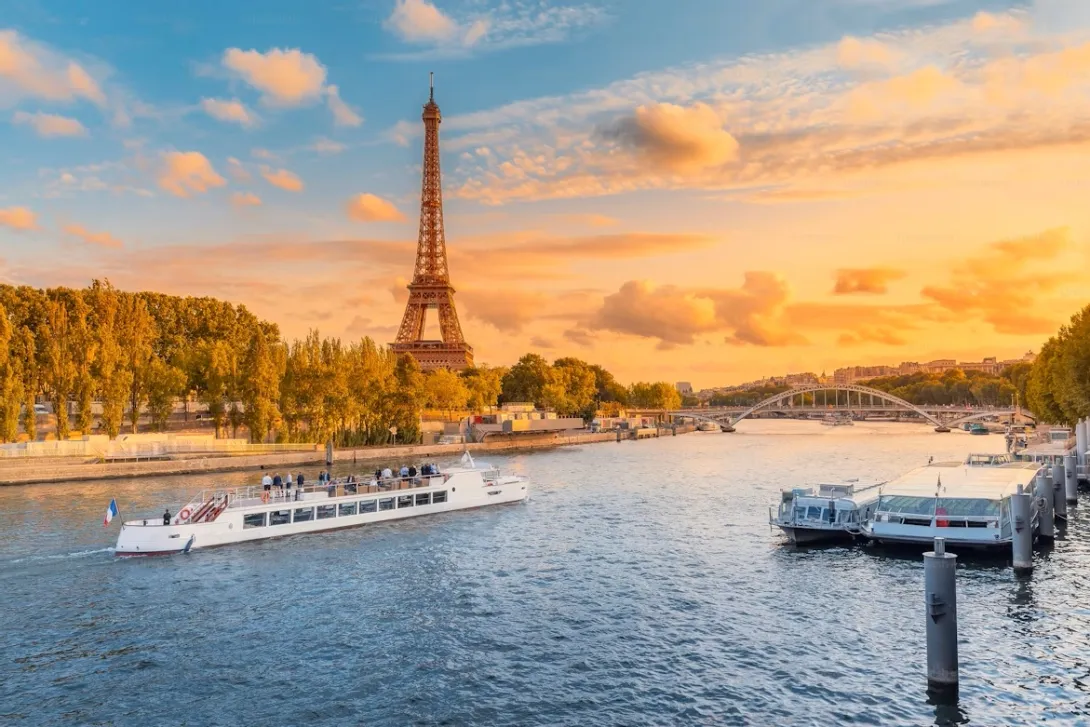 A romantic couple standing on a hill overlooking the sunset vineyards of Sancerre during a Valentine's Day road trip