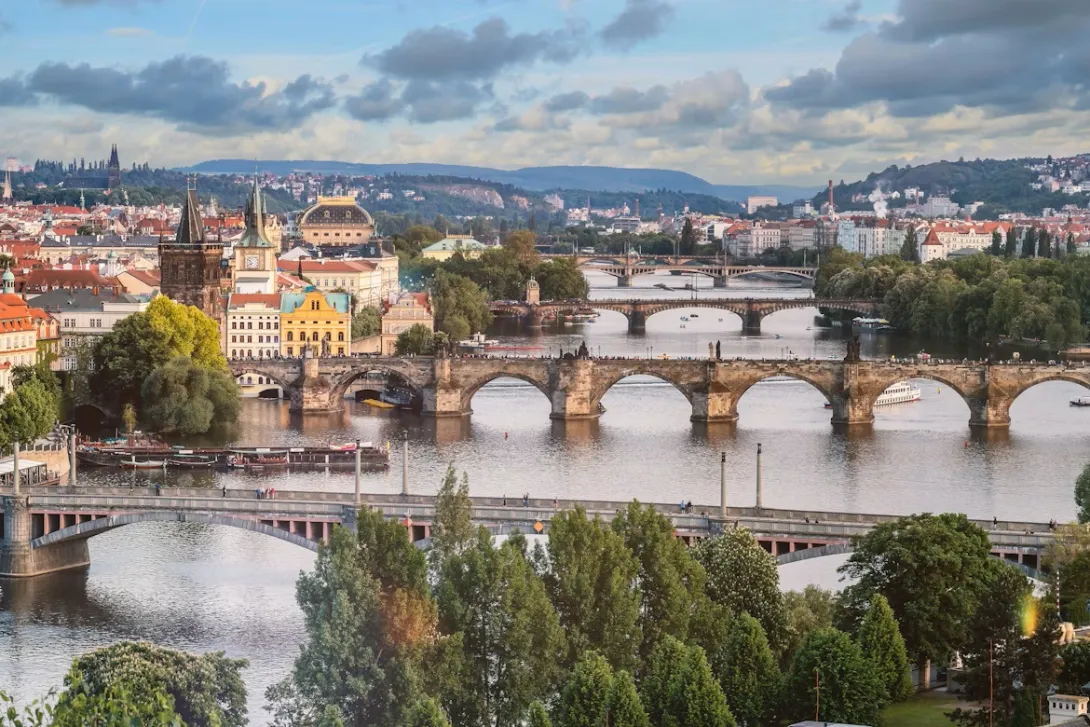 Panoramic view of Prague Old Town and Vltava River, the starting point of a scenic road trip from Prague to Vienna.