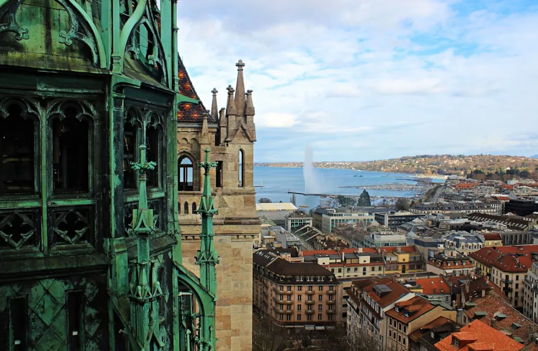Panoramic view of Geneva city skyline with the Jet d'Eau fountain on Lake Geneva, starting point of the scenic drive to Montreux.