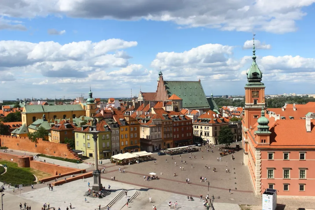 Panoramic view of central Warsaw with modern buildings and historic landmarks, marking the start of the road trip to Lublin.