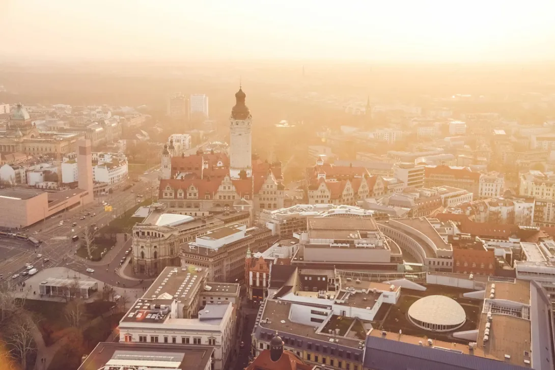 Panoramic view of Leipzig city center with historic architecture, church towers, and modern urban skyline in Germany.