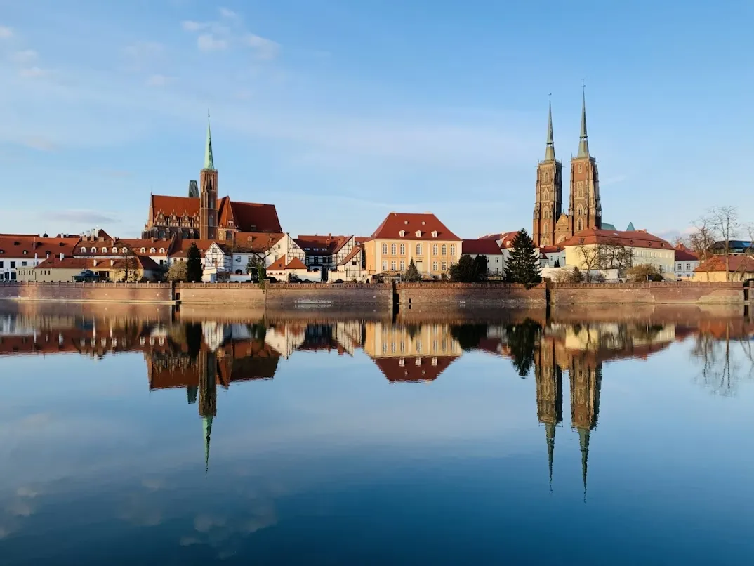 View of Wroclaw Market Square with colorful historic townhouses and Gothic architecture in Poland.