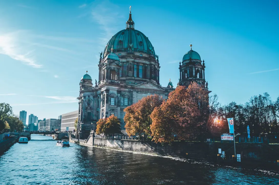 Panoramic view of Berlin, Germany, featuring the city skyline with the Fernsehturm, historic architecture, modern buildings, and iconic urban landmarks under clear daylight, capturing the vibrant atmosphere of the starting point of a Berlin to Dresden road trip.